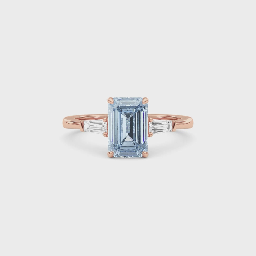 Rose gold Three-Stone Fancy Blue Emerald Cut Diamond Ring with Tapered Baguette Side Stones