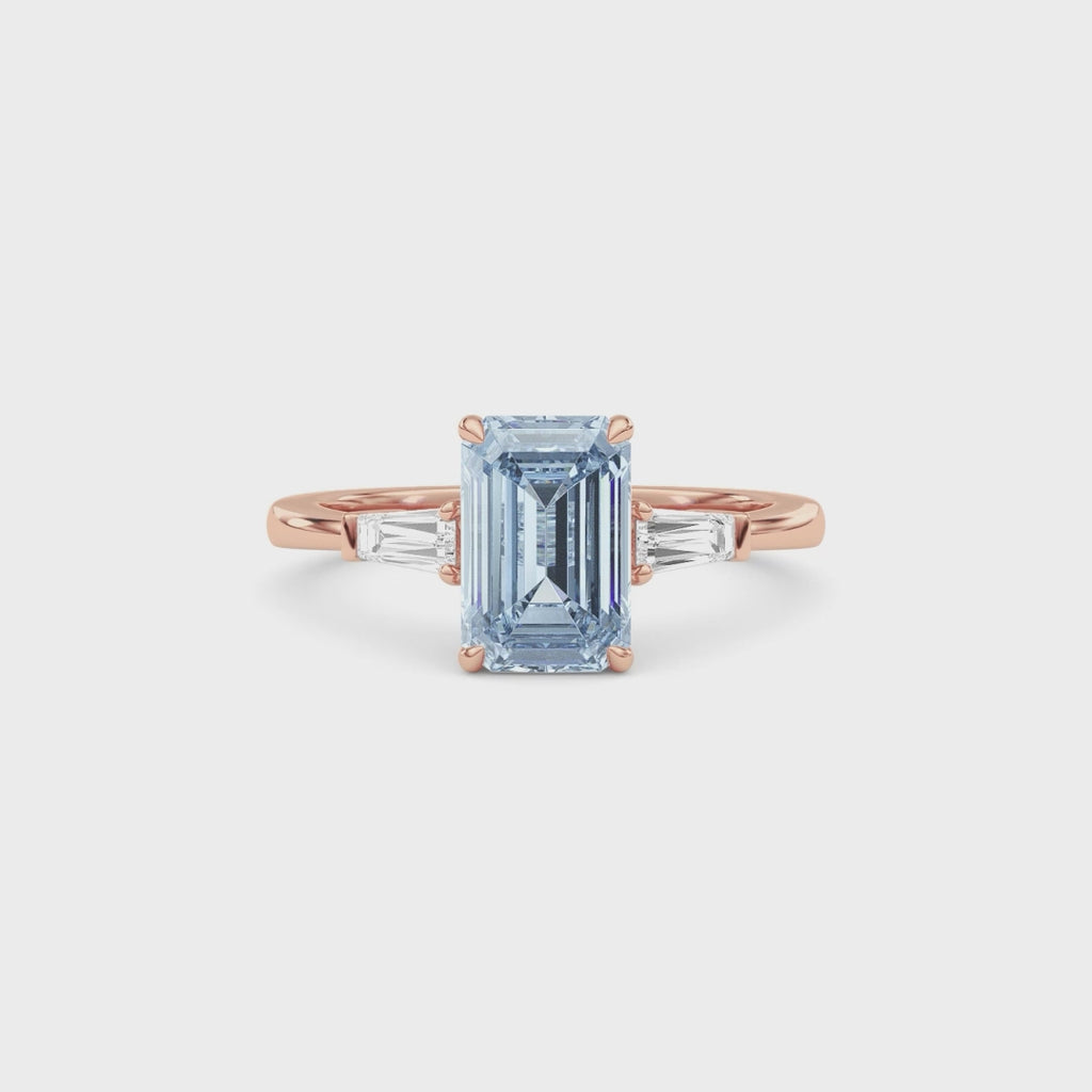 Rose gold Three-Stone Fancy Blue Emerald Cut Diamond Ring with Tapered Baguette Side Stones