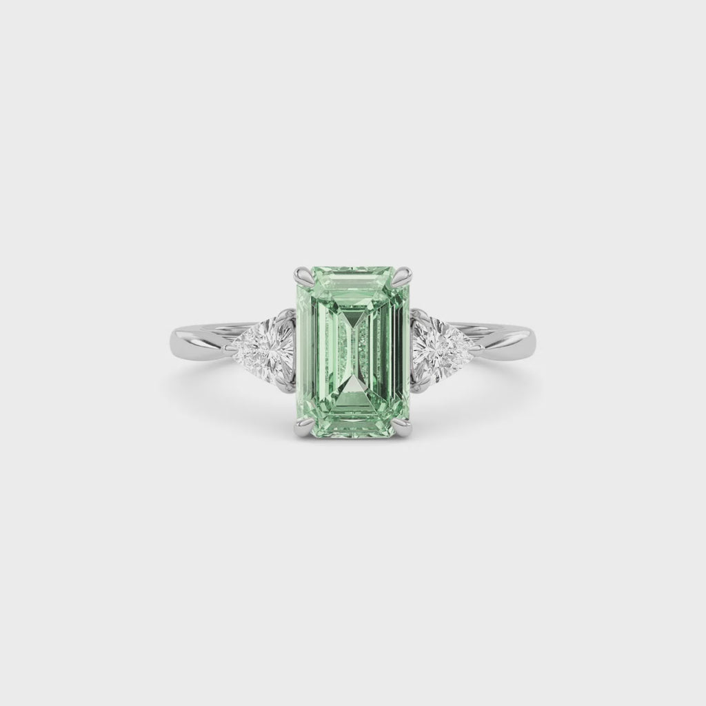 White gold Three-Stone Fancy Green Emerald Cut Diamond Ring with Trillion Side Stones