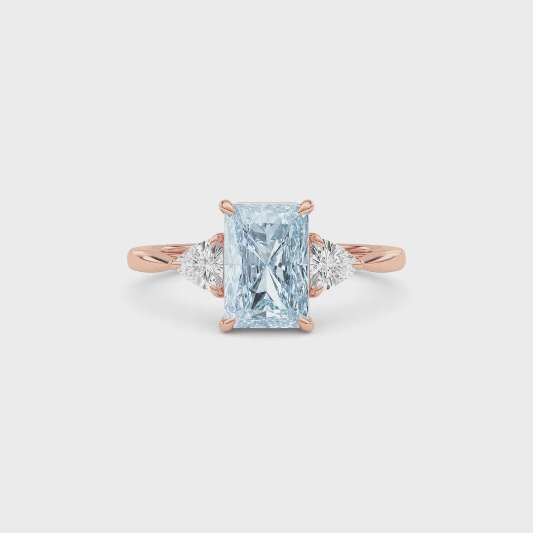 Rose gold Three-Stone Fancy Blue Radiant Cut Diamond Ring with Trillion Side Stones