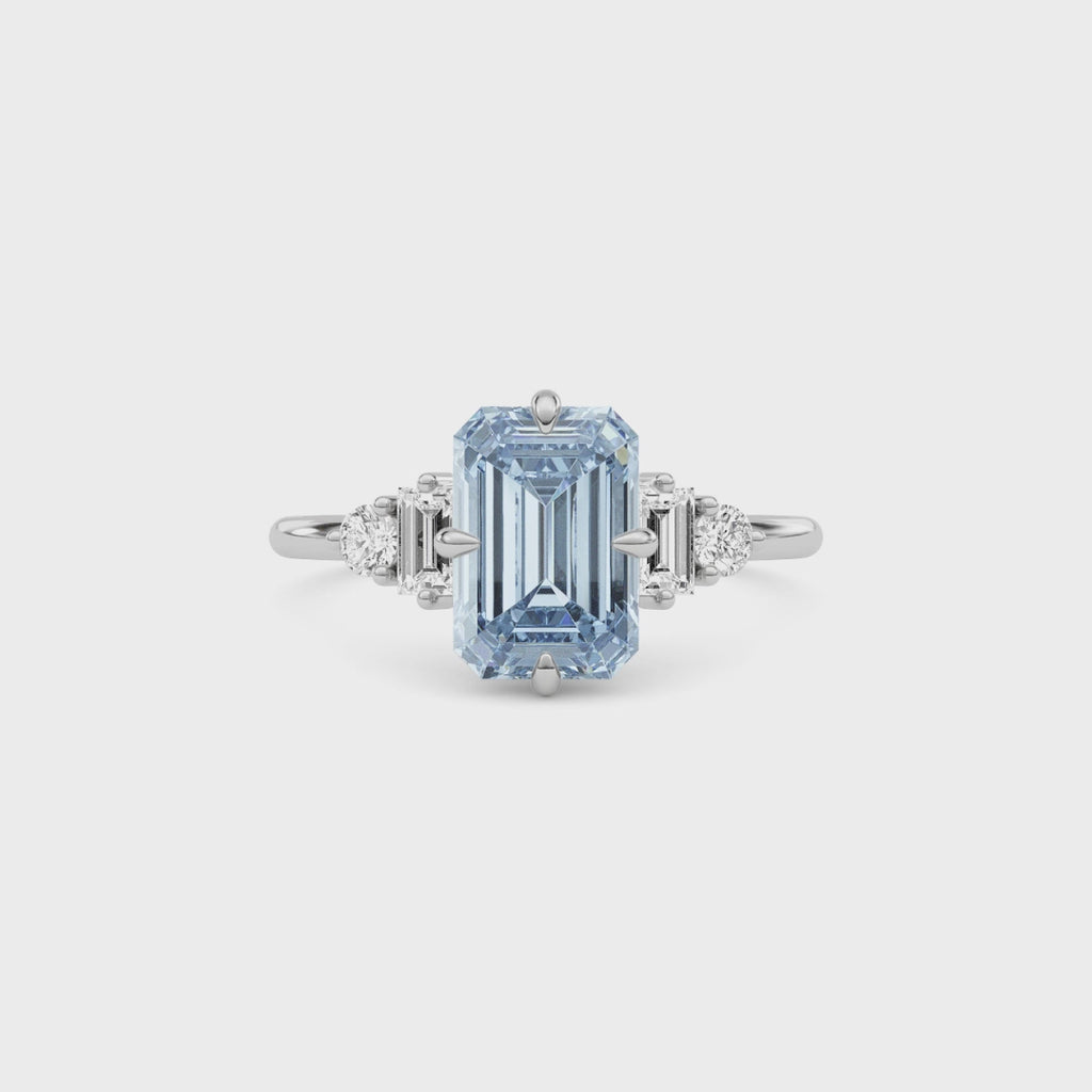 Silver Fancy Blue Emerald Cut Three Stone Diamond Engagement Ring with Tapered Baguette and Round Side Stones