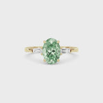 Yellow gold Three-Stone Fancy Green Oval Cut Diamond Ring with Tapered Baguette Side Stones