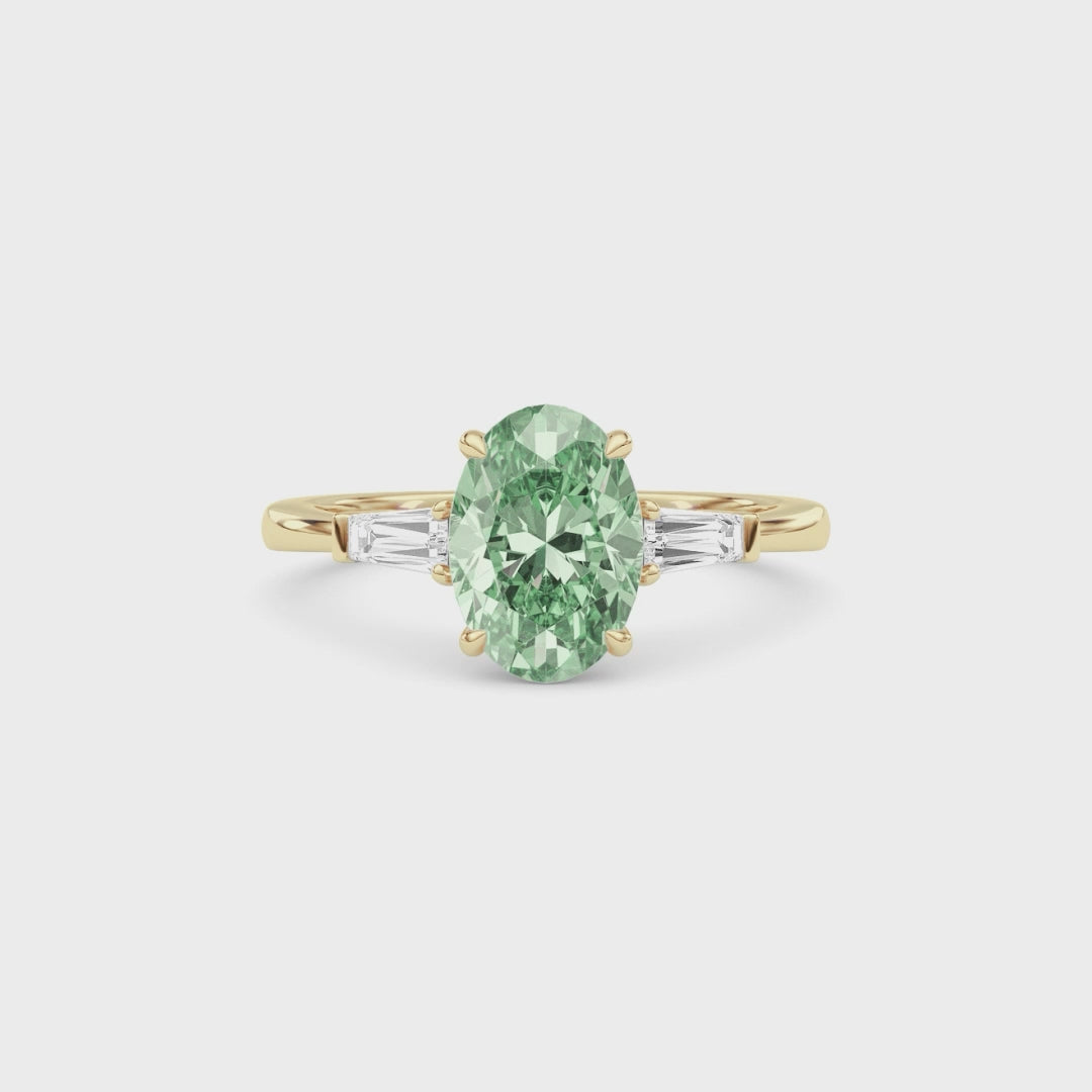 Yellow gold Three-Stone Fancy Green Oval Cut Diamond Ring with Tapered Baguette Side Stones