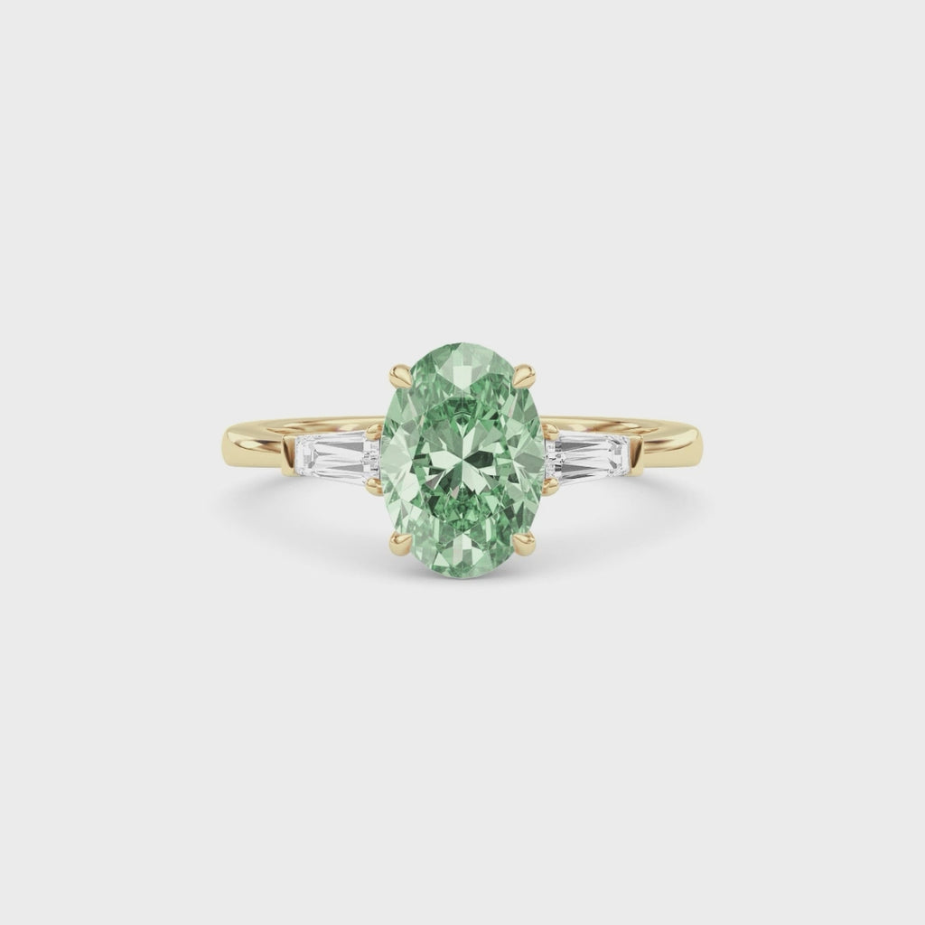 Yellow gold Three-Stone Fancy Green Oval Cut Diamond Ring with Tapered Baguette Side Stones
