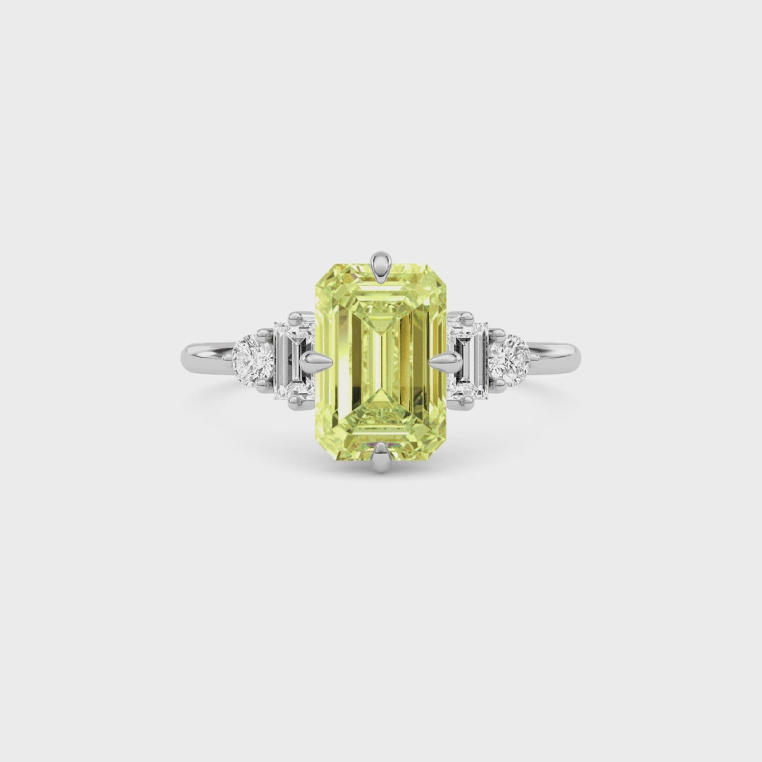 Yellow gold Three-Stone Fancy Yellow Emerald Cut Diamond Ring with Heart Side Stones