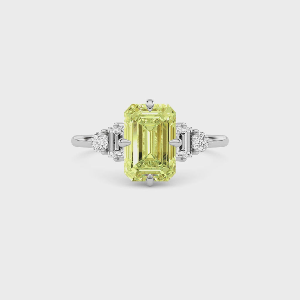 Yellow gold Three-Stone Fancy Yellow Emerald Cut Diamond Ring with Heart Side Stones