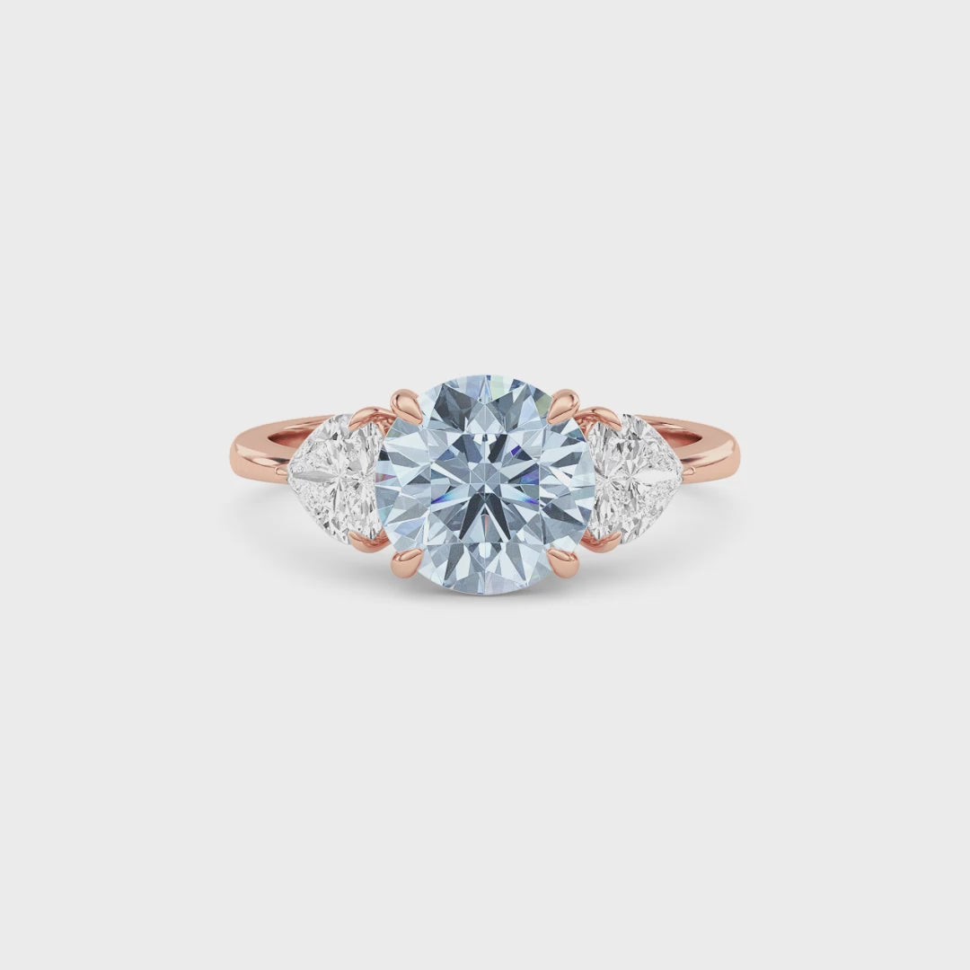 Rose gold Three-Stone Fancy Blue Round Cut Diamond Ring with Heart Side Stones