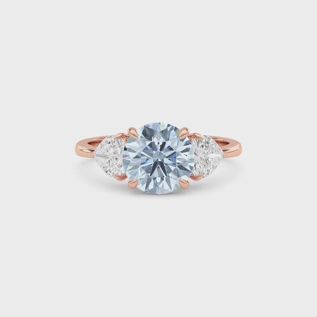 Rose gold Three-Stone Fancy Blue Round Cut Diamond Ring with Heart Side Stones