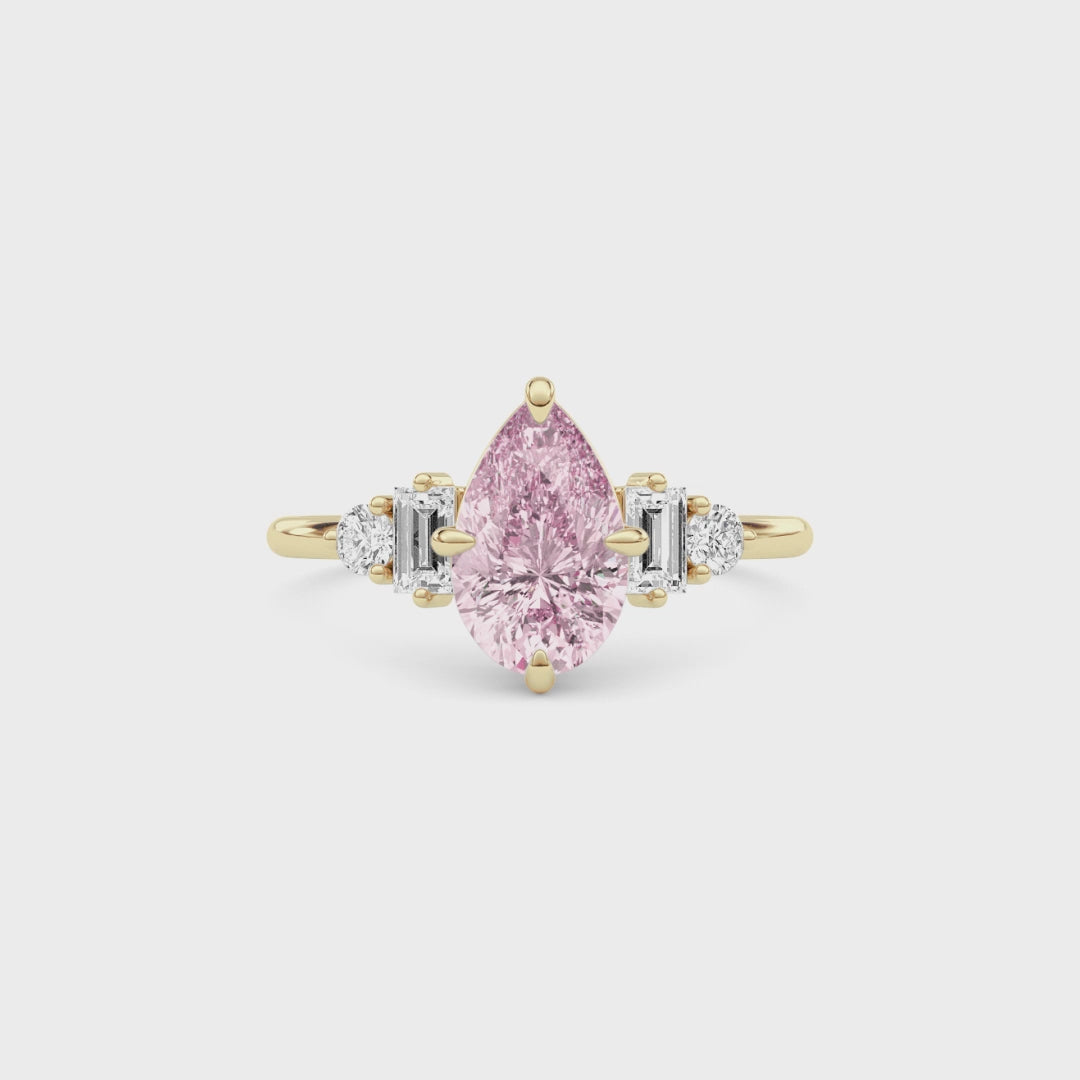 Yellow gold Fancy Pink Pear Cut Three Stone Diamond Engagement Ring with Tapered Baguette and Round Side Stones