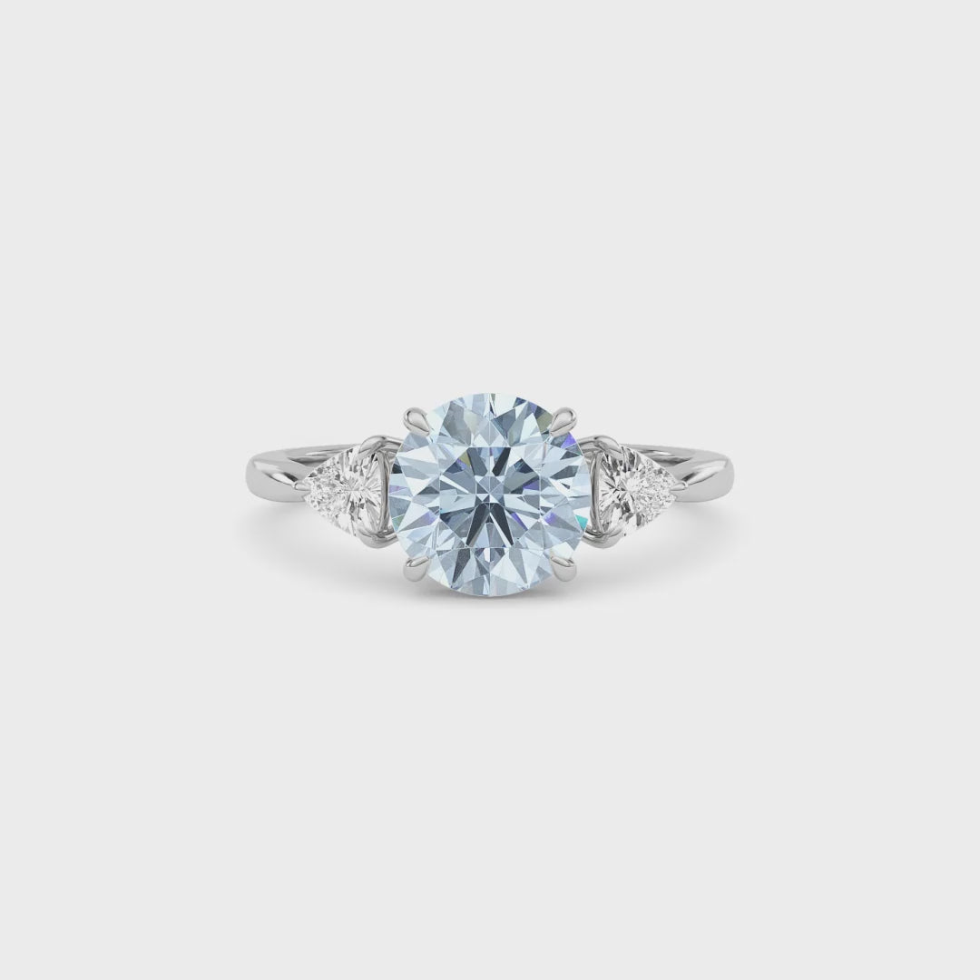 Platinum Three-Stone Fancy Blue Round Cut Diamond Ring with Trillion Side Stones
