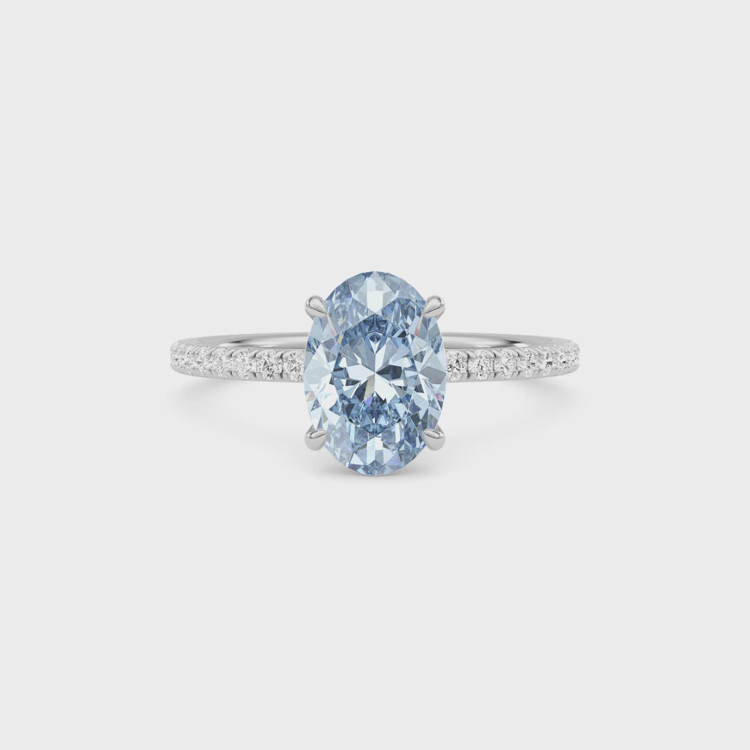 White gold Fancy Blue Oval Cut Diamond Solitaire with Pavé Band