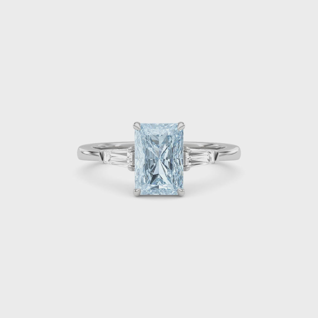 Silver Three-Stone Fancy Blue Radiant Cut Diamond Ring with Tapered Baguette Side Stones