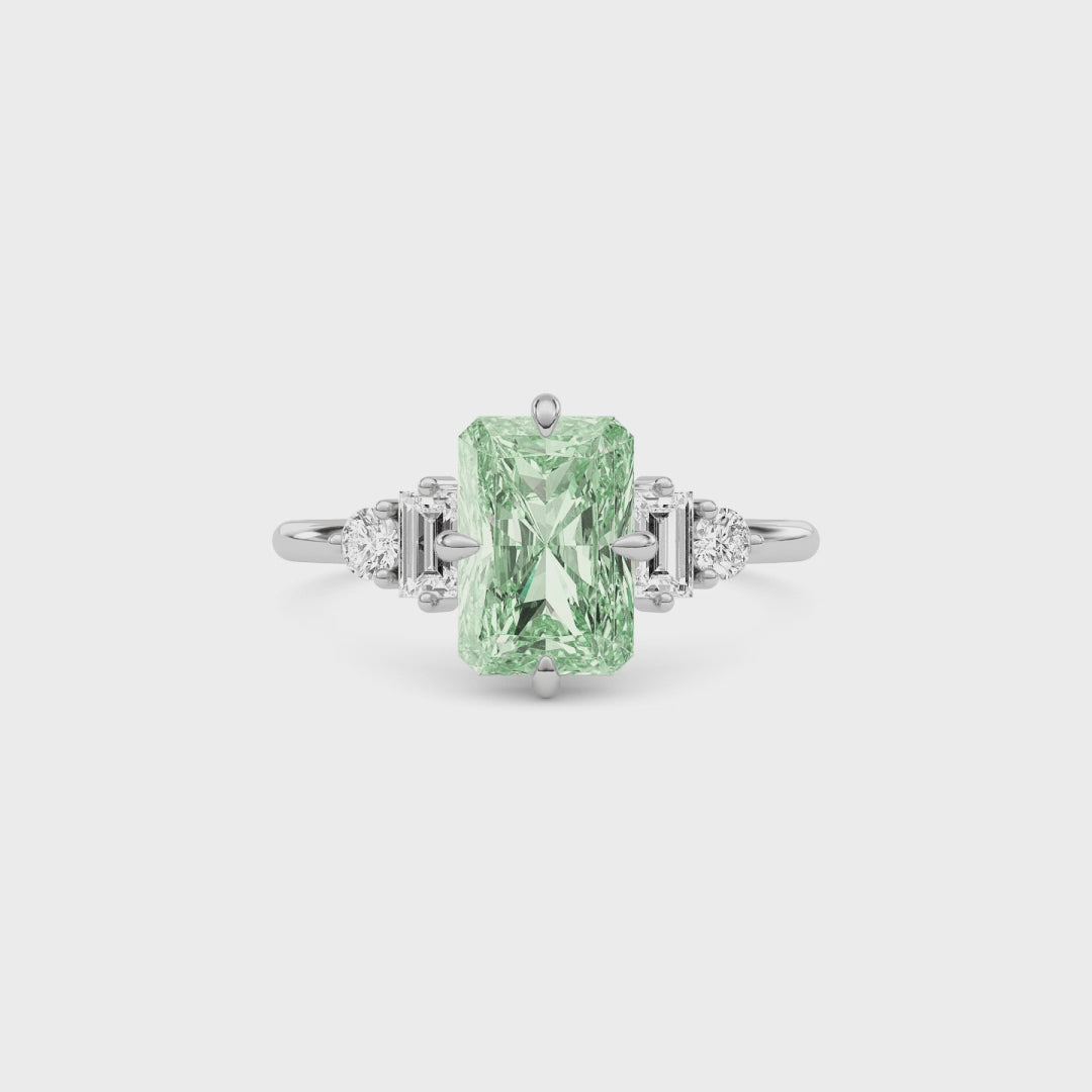 Platinum Fancy Green Radiant Cut Three Stone Diamond Engagement Ring with Tapered Baguette and Round Side Stones