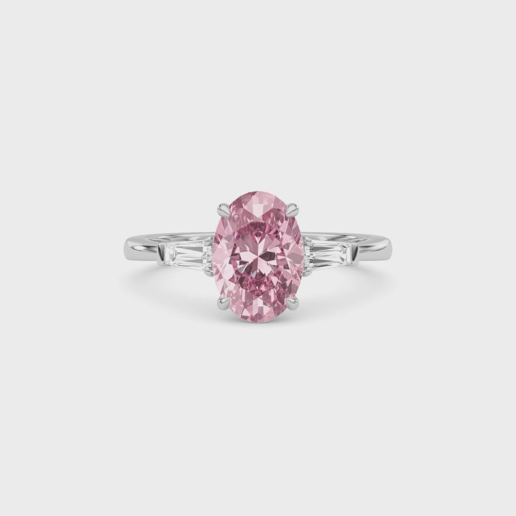 Platinum Three-Stone Fancy Pink Oval Cut Diamond Ring with Tapered Baguette Side Stones