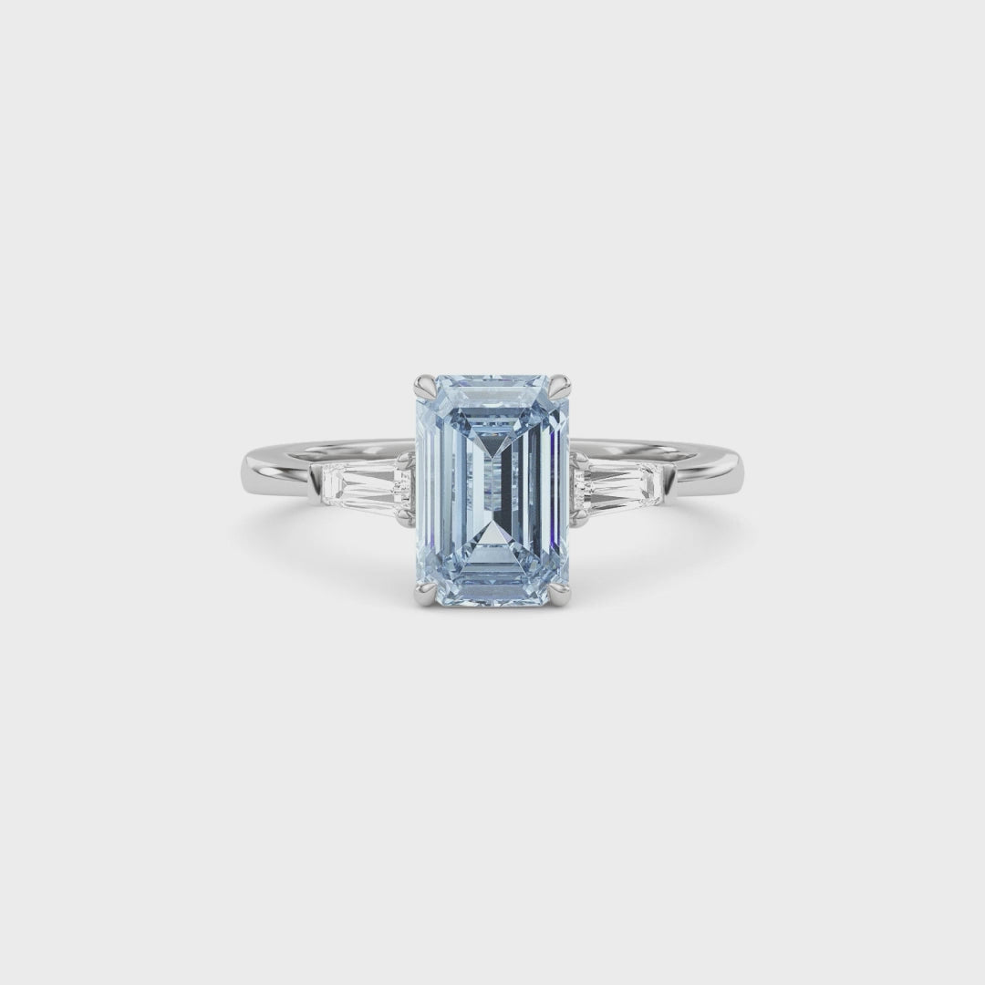 Silver Three-Stone Fancy Blue Emerald Cut Diamond Ring with Tapered Baguette Side Stones