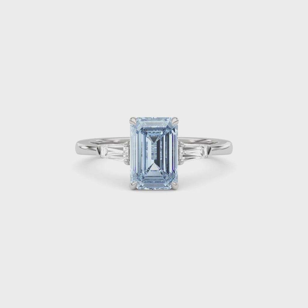Silver Three-Stone Fancy Blue Emerald Cut Diamond Ring with Tapered Baguette Side Stones