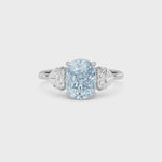 Platinum Three-Stone Fancy Blue Cushion Cut Diamond Ring with Heart Side Stones