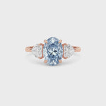 Rose gold Three-Stone Fancy Blue Oval Cut Diamond Ring with Heart Side Stones
