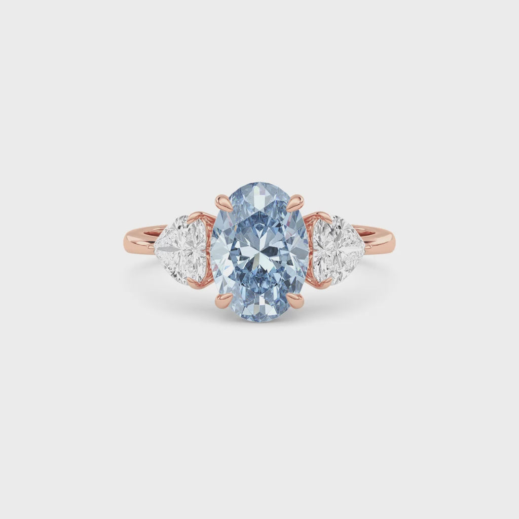 Rose gold Three-Stone Fancy Blue Oval Cut Diamond Ring with Heart Side Stones