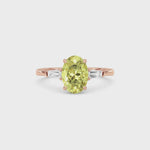 Rose gold Three-Stone Fancy Yellow Oval Cut Diamond Ring with Tapered Baguette Side Stones