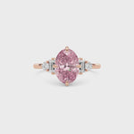 Rose gold Fancy Pink Oval Cut Three Stone Diamond Engagement Ring with Tapered Baguette and Round Side Stones