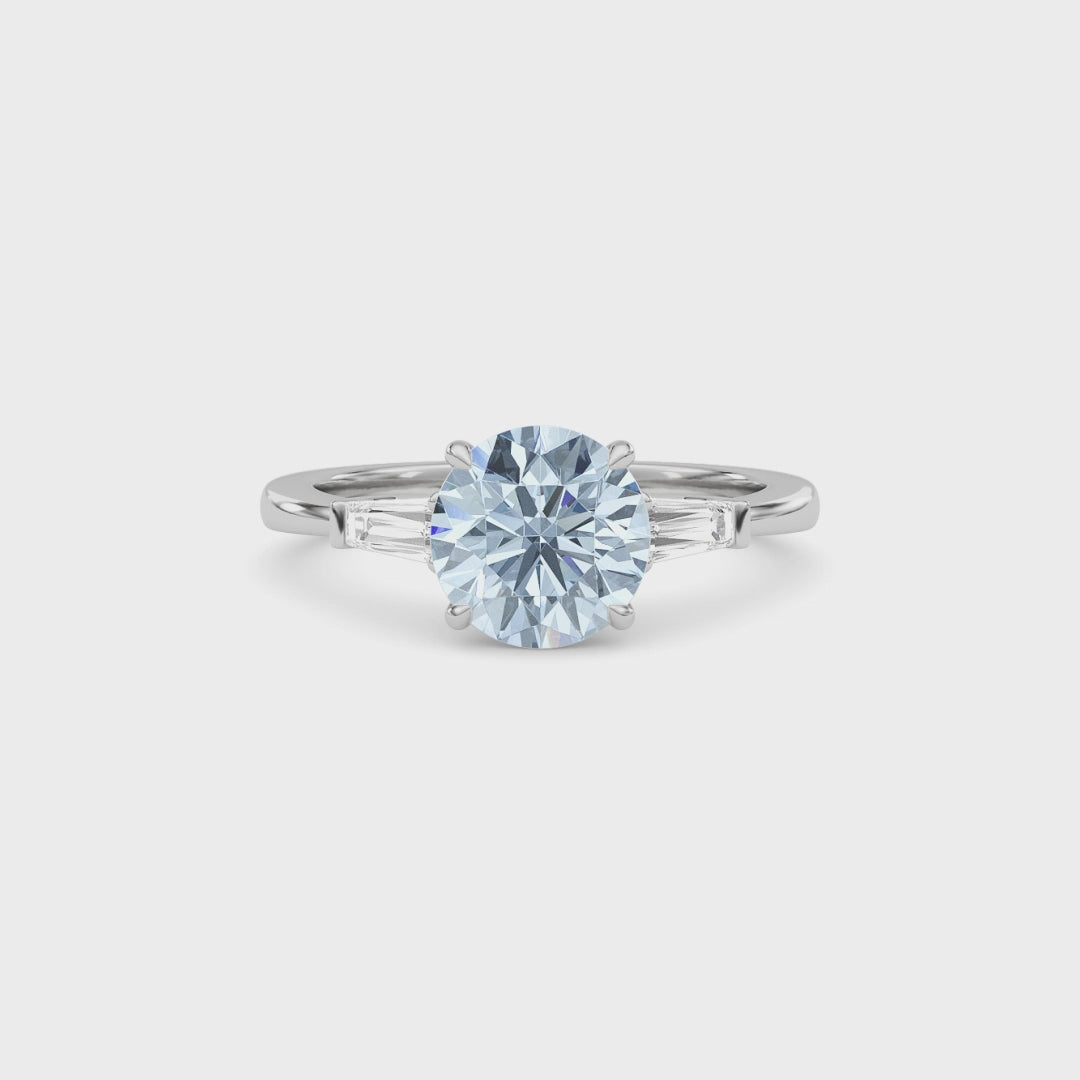 Silver Three-Stone Fancy Blue Round Cut Diamond Ring with Tapered Baguette Side Stones