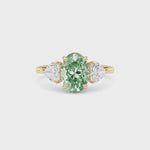 Yellow gold Three-Stone Fancy Green Oval Cut Diamond Ring with Heart Side Stones