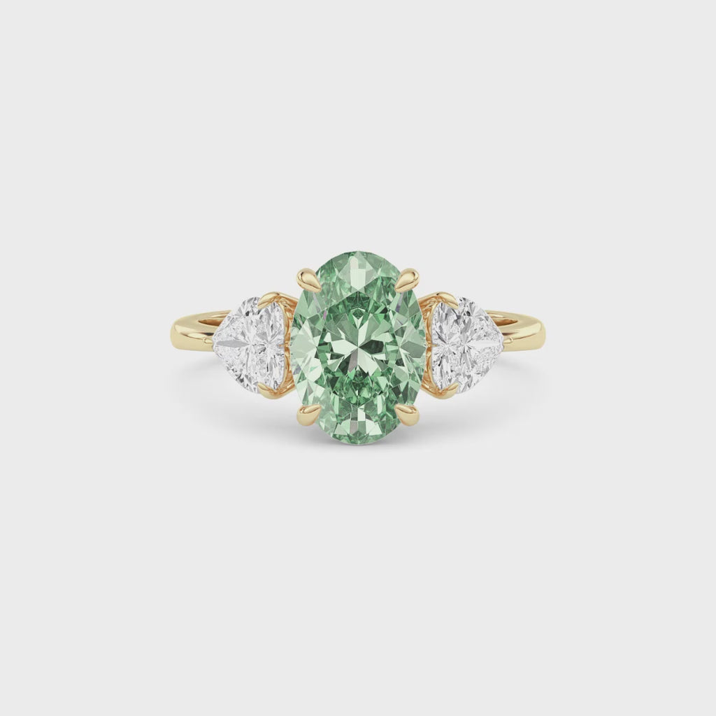 Yellow gold Three-Stone Fancy Green Oval Cut Diamond Ring with Heart Side Stones
