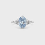 Platinum Fancy Blue Oval Cut Three Stone Diamond Engagement Ring with Tapered Baguette and Round Side Stones