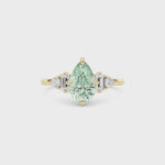 Yellow gold Fancy Green Pear Cut Three Stone Diamond Engagement Ring with Tapered Baguette and Round Side Stones
