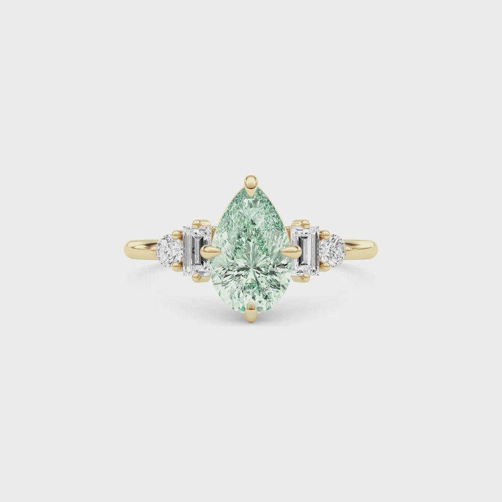 Yellow gold Fancy Green Pear Cut Three Stone Diamond Engagement Ring with Tapered Baguette and Round Side Stones