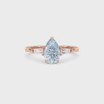 Rose gold Three-Stone Fancy Blue Pear Cut Diamond Ring with Tapered Baguette Side Stones