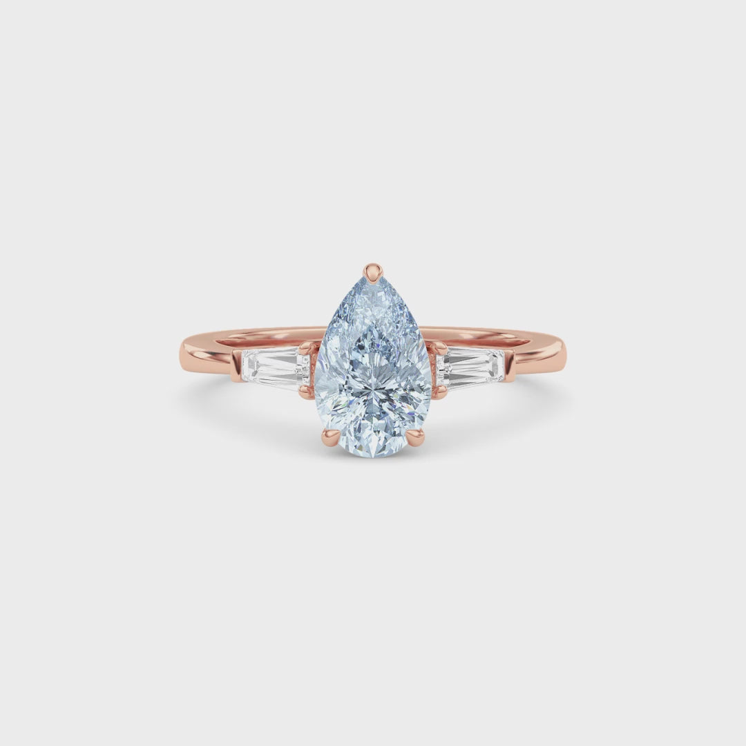 Rose gold Three-Stone Fancy Blue Pear Cut Diamond Ring with Tapered Baguette Side Stones