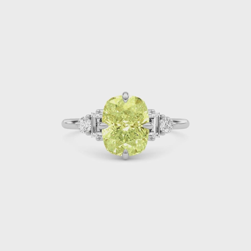 Yellow gold Fancy Yellow Cushion Cut Three Stone Diamond Engagement Ring with Tapered Baguette and Round Side Stones