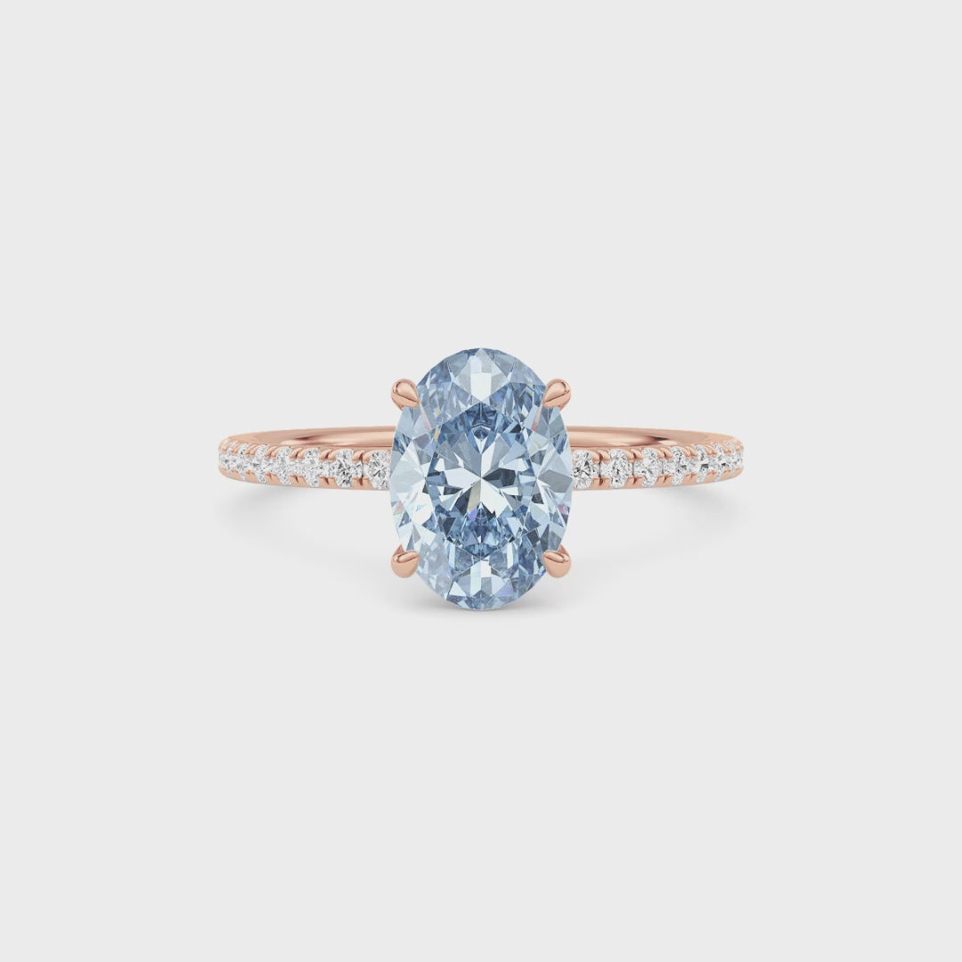 Rose gold Fancy Blue Oval Cut Diamond Solitaire with Pavé Band