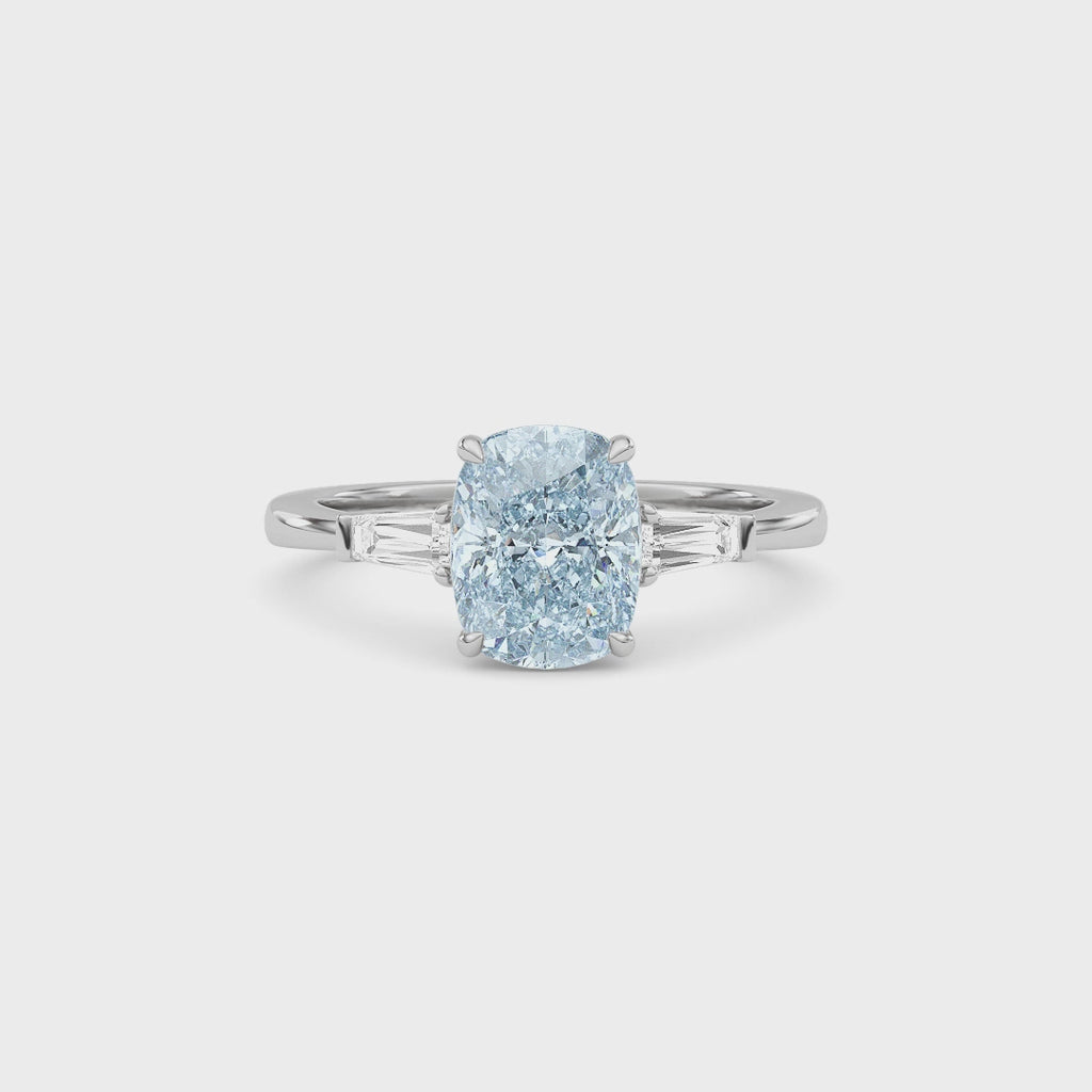 White gold Three-Stone Fancy Blue Cushion Cut Diamond Ring with Tapered Baguette Side Stones