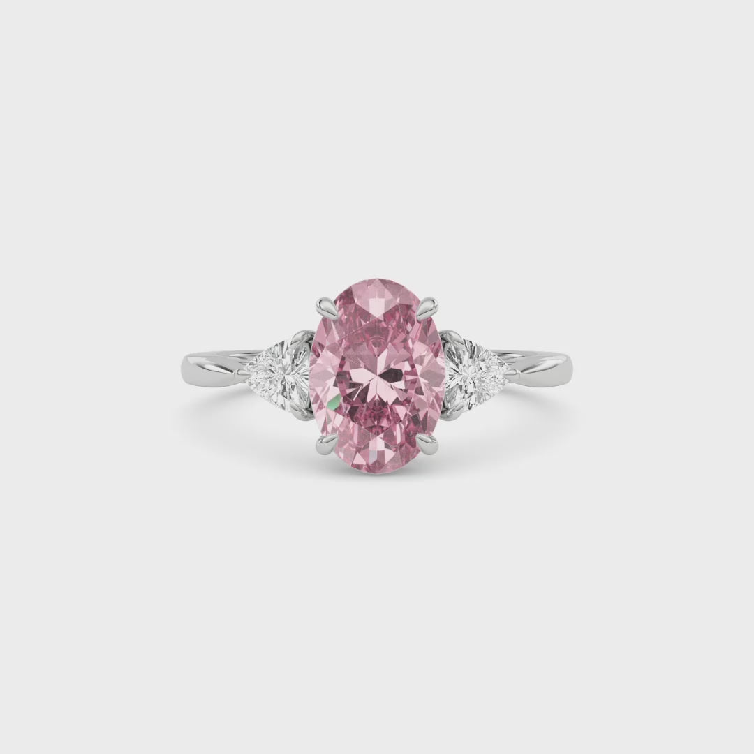 Platinum Three-Stone Fancy Pink Oval Cut Diamond Ring with Trillion Side Stones