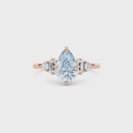 Rose gold Fancy Blue Pear Cut Three Stone Diamond Engagement Ring with Tapered Baguette and Round Side Stones