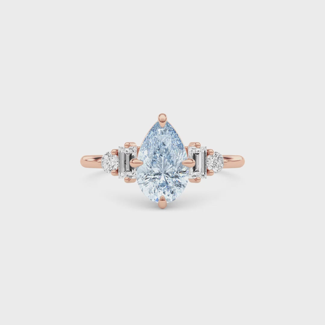 Rose gold Fancy Blue Pear Cut Three Stone Diamond Engagement Ring with Tapered Baguette and Round Side Stones
