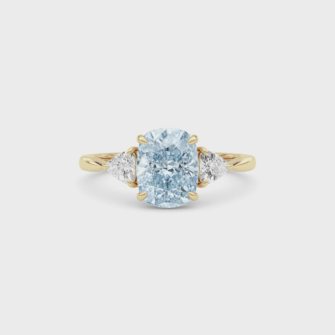 Yellow gold Three-Stone Fancy Blue Cushion Cut Diamond Ring with Trillion Side Stones