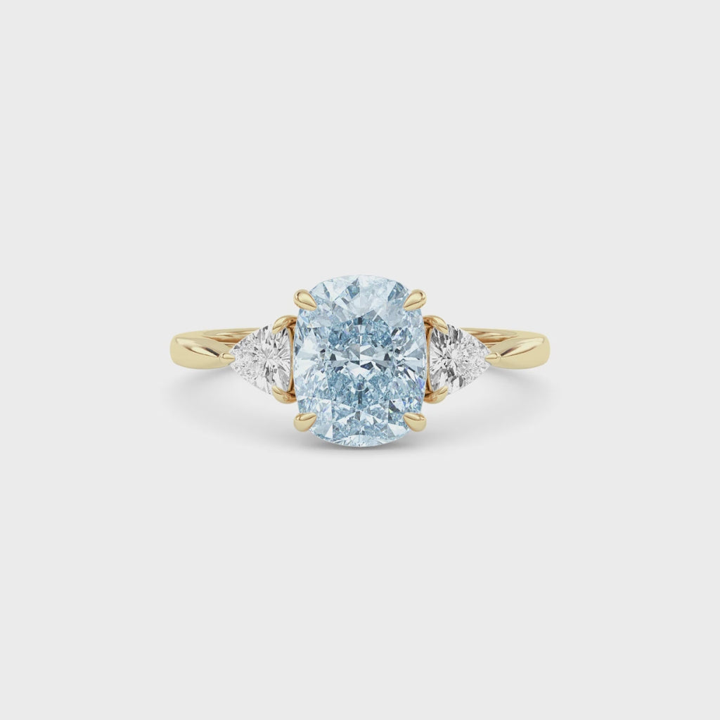 Yellow gold Three-Stone Fancy Blue Cushion Cut Diamond Ring with Trillion Side Stones