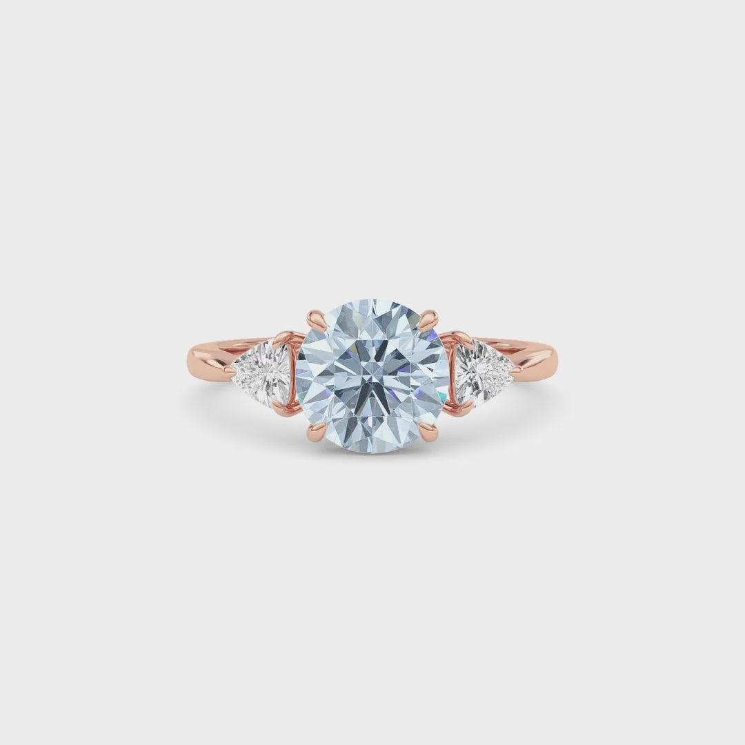 Rose gold Three-Stone Fancy Blue Round Cut Diamond Ring with Trillion Side Stones