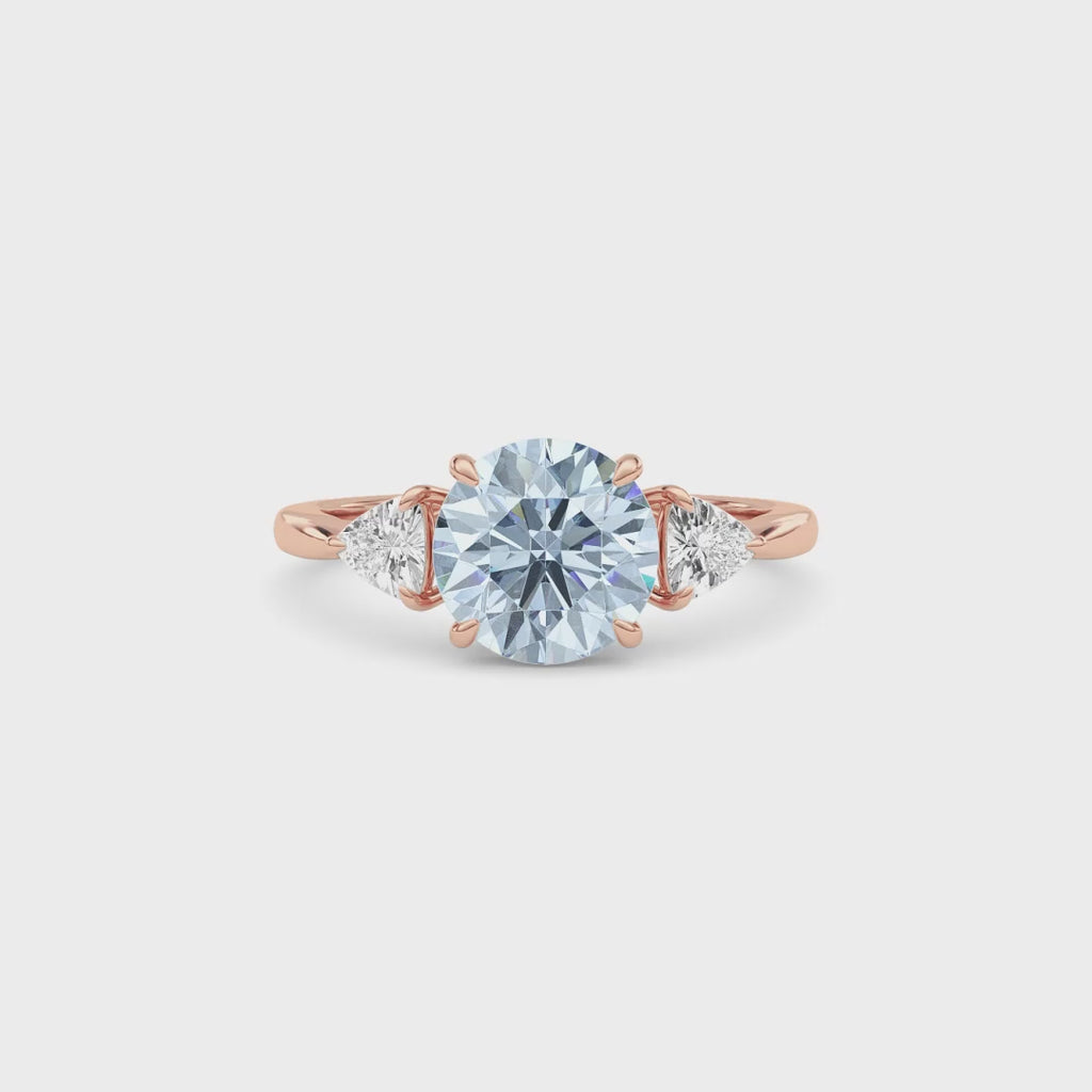 Rose gold Three-Stone Fancy Blue Round Cut Diamond Ring with Trillion Side Stones