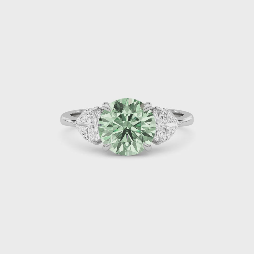 White gold Three-Stone Fancy Green Round Cut Diamond Ring with Heart Side Stones