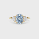 Yellow gold Three-Stone Fancy Blue Oval Cut Diamond Ring with Heart Side Stones