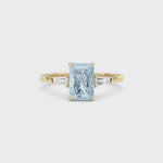 Yellow gold Three-Stone Fancy Blue Radiant Cut Diamond Ring with Tapered Baguette Side Stones