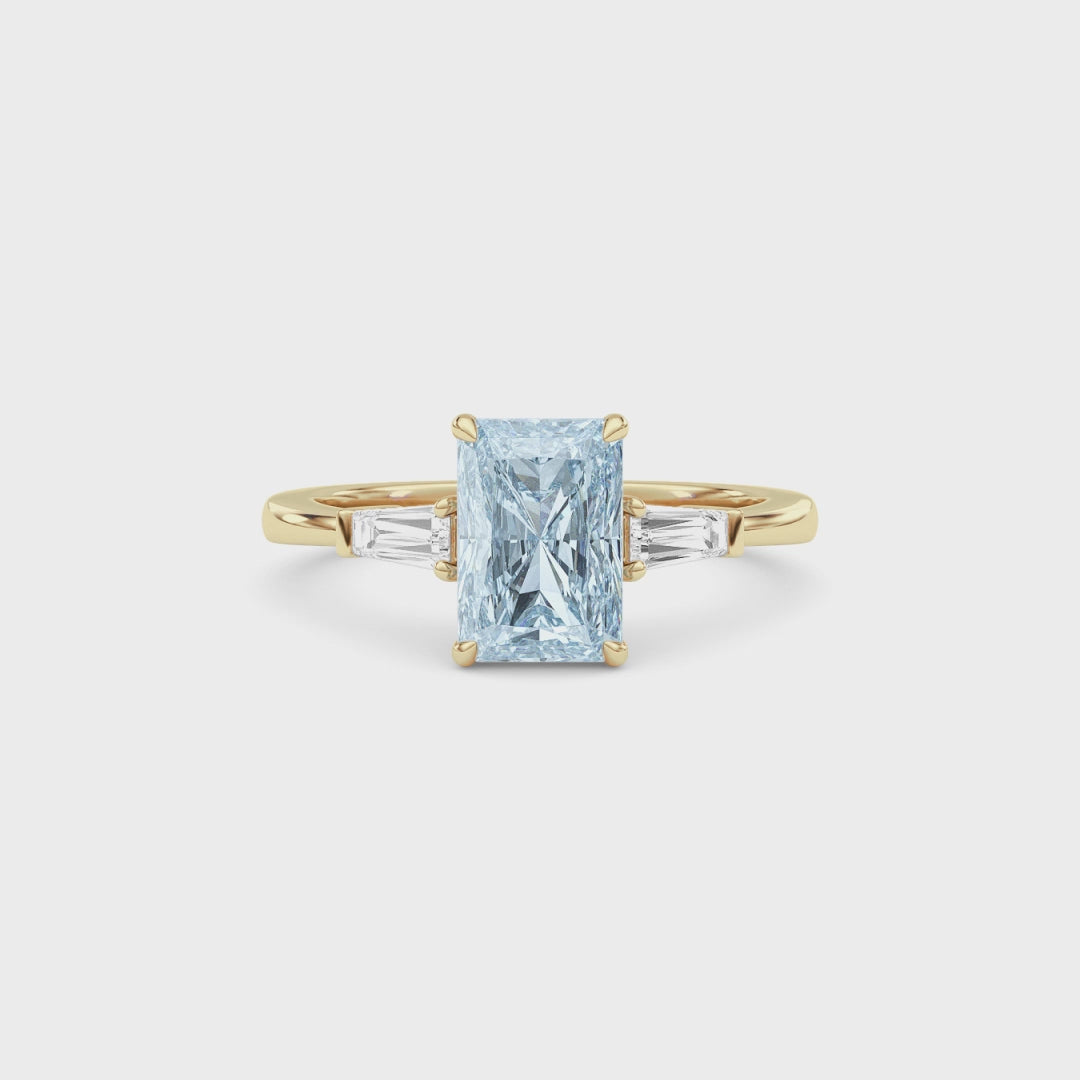 Yellow gold Three-Stone Fancy Blue Radiant Cut Diamond Ring with Tapered Baguette Side Stones