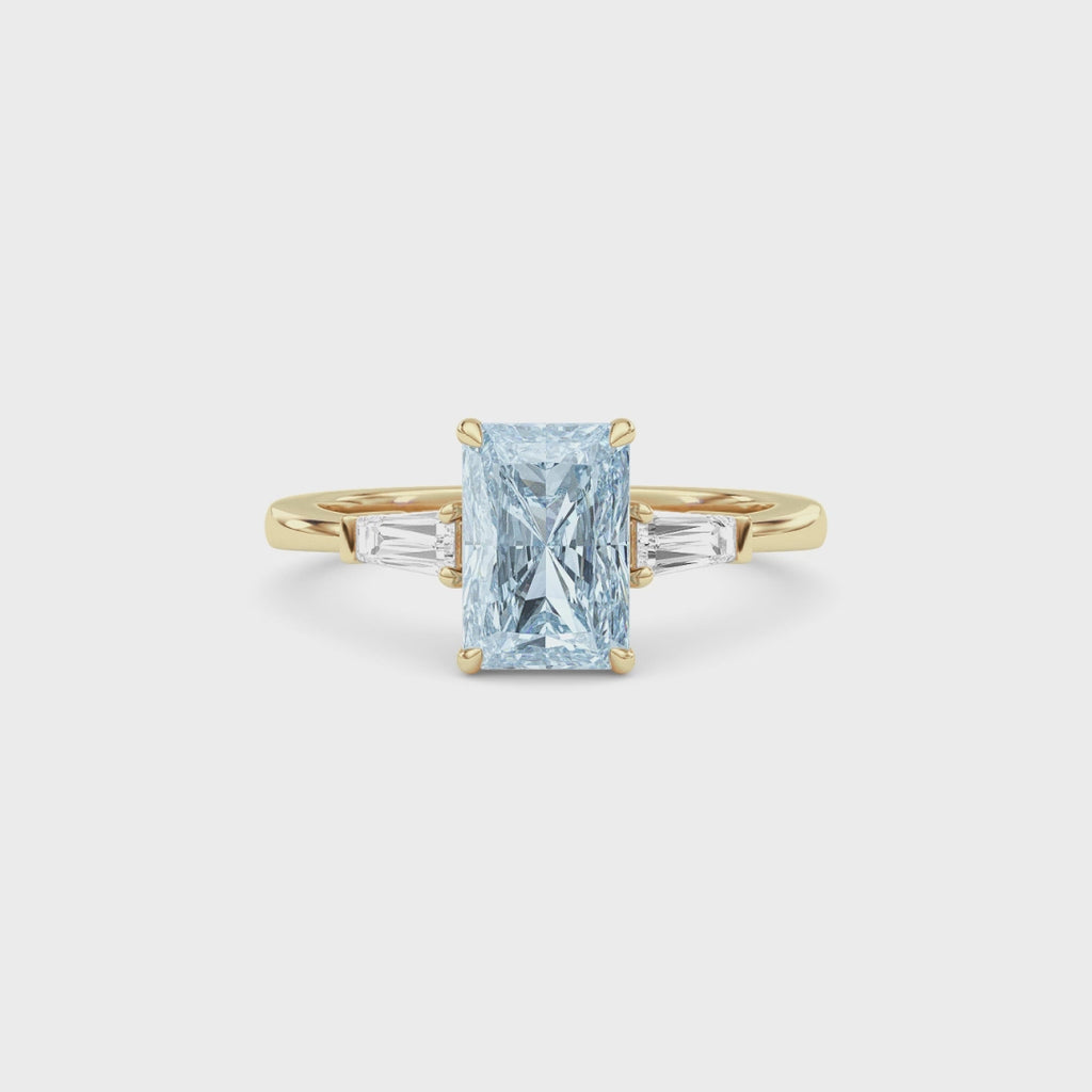 Yellow gold Three-Stone Fancy Blue Radiant Cut Diamond Ring with Tapered Baguette Side Stones