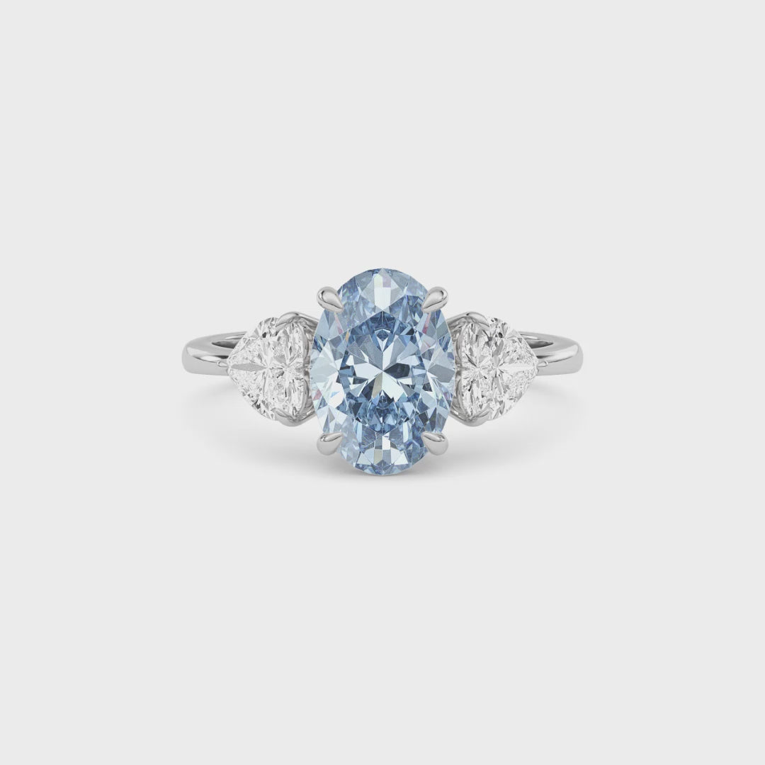 Silver Three-Stone Fancy Blue Oval Cut Diamond Ring with Heart Side Stones