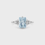 Platinum Fancy Blue Radiant Cut Three Stone Diamond Engagement Ring with Tapered Baguette and Round Side Stones